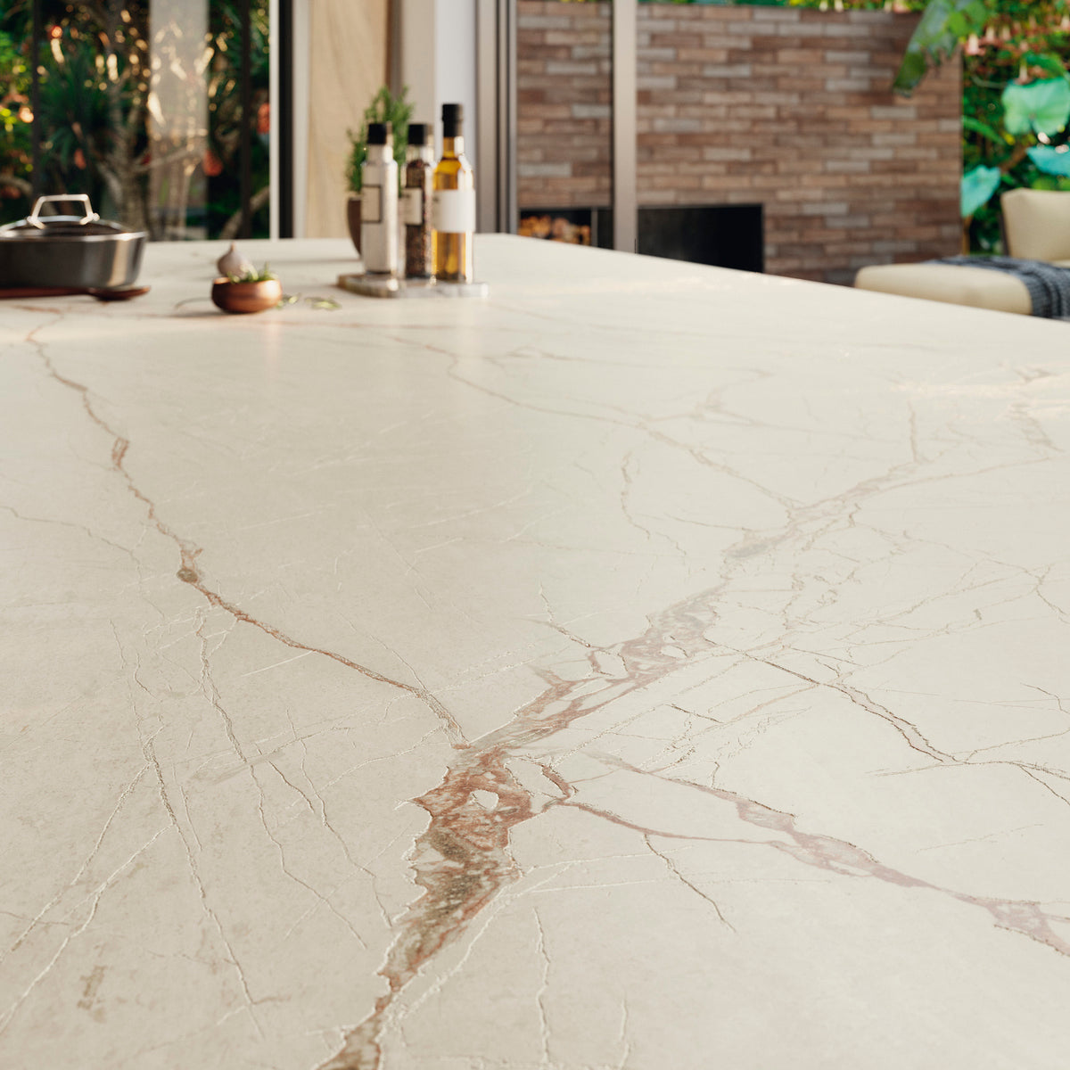 Close-up of Grespania Canela Roma marble effect surface showing its reddish-brown veins and subtle texture