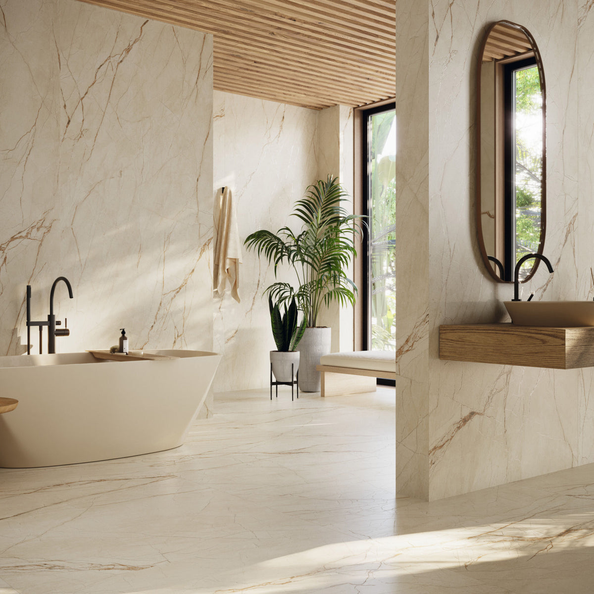 Grespania Canela Roma marble effect tiles on the walls and floor of a bathroom with a freestanding bath