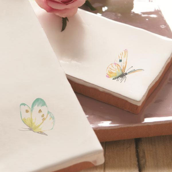 Tiles from the Residence Butterflies collection, shown on a papyrus base.