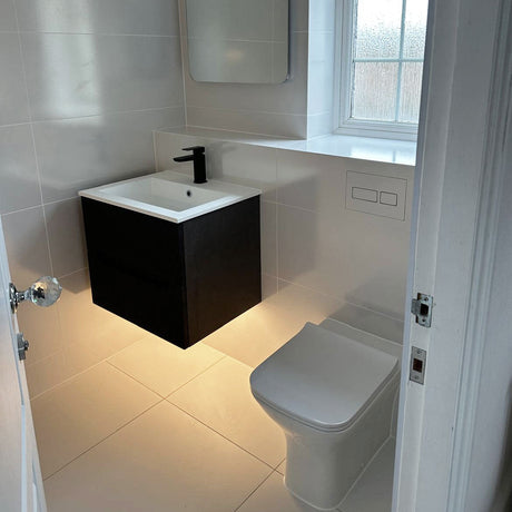 Black wall-hung vanity unit with back to wall pan, Furzton bathroom renovation designed and supplied by TABO