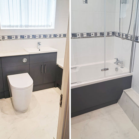 Refitted bathroom with grey vanity units, back-to-wall toilet, and a bath with glass shower screen, white tiled walls with a patterned border.