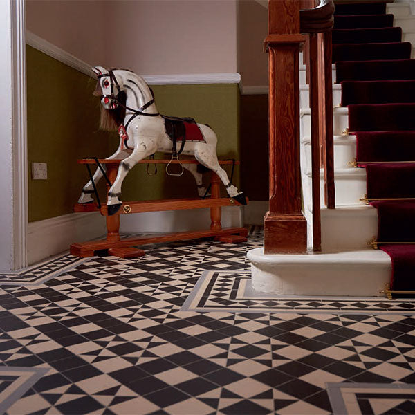 Braemar pattern in Black and White with a border based on Bronte